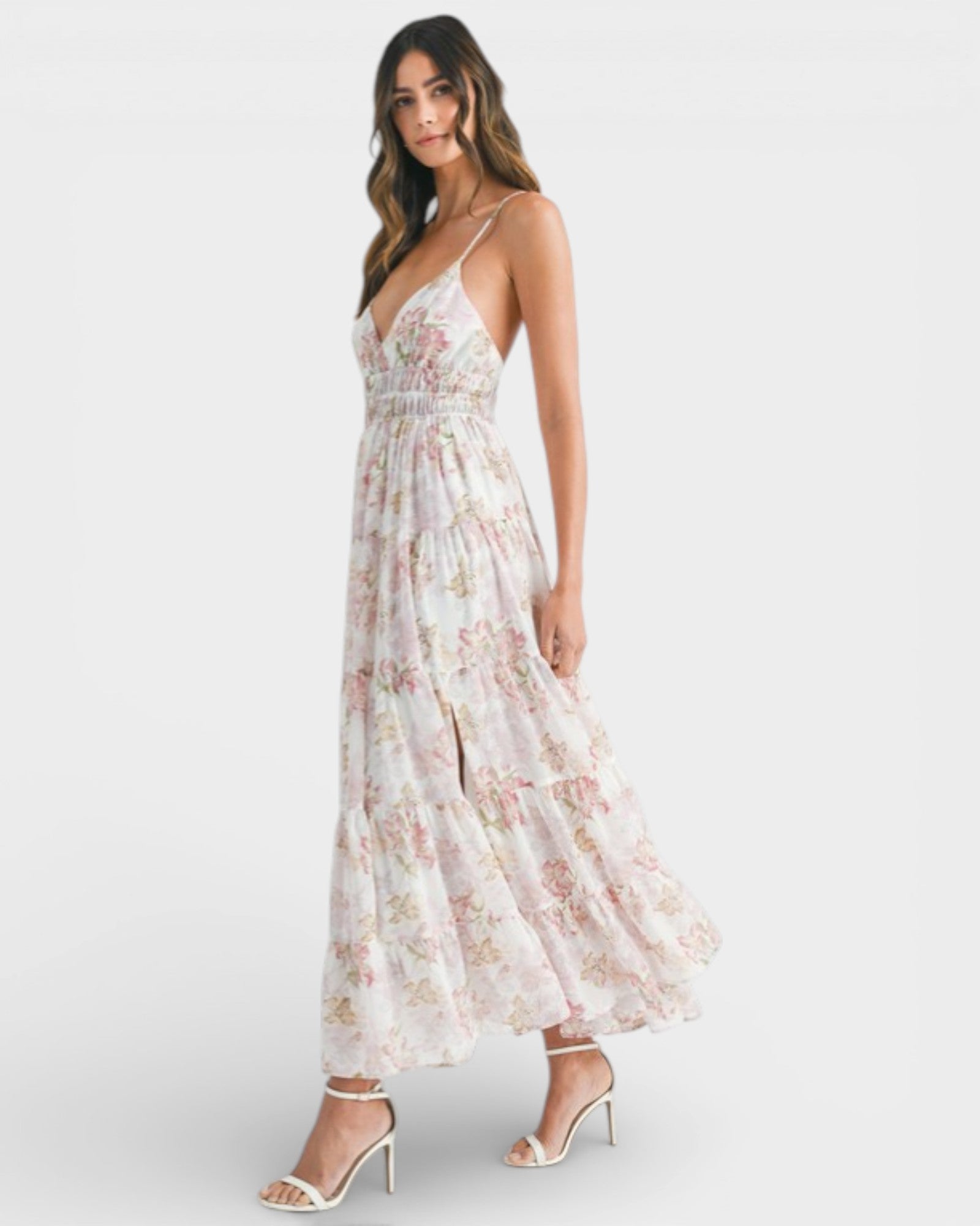 Woman wearing a floral dress on a white background