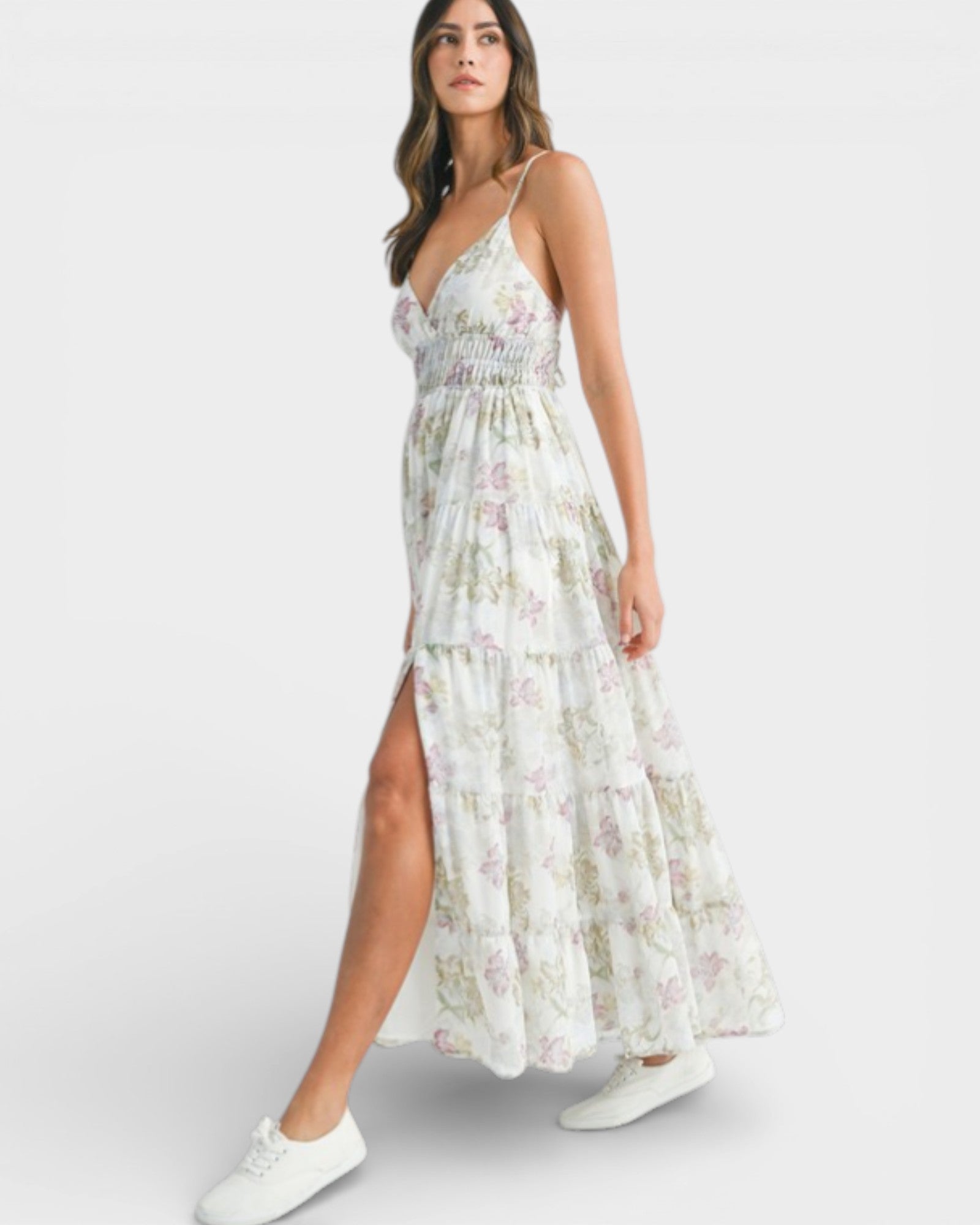Woman wearing a floral dress with a white background