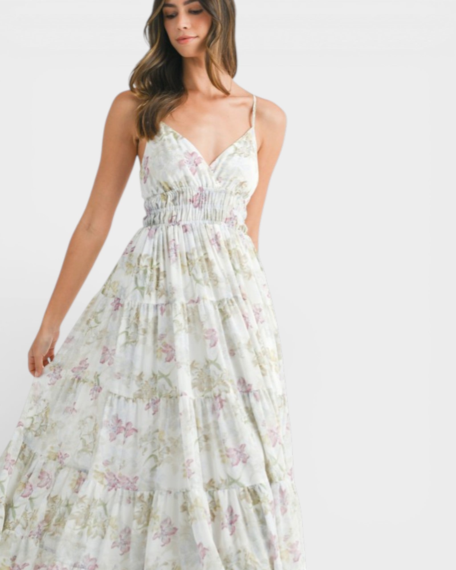 Woman wearing a floral dress on a white background