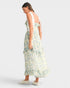Woman wearing a floral dress on a white background