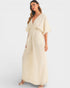 Woman wearing a beige dress on a white background