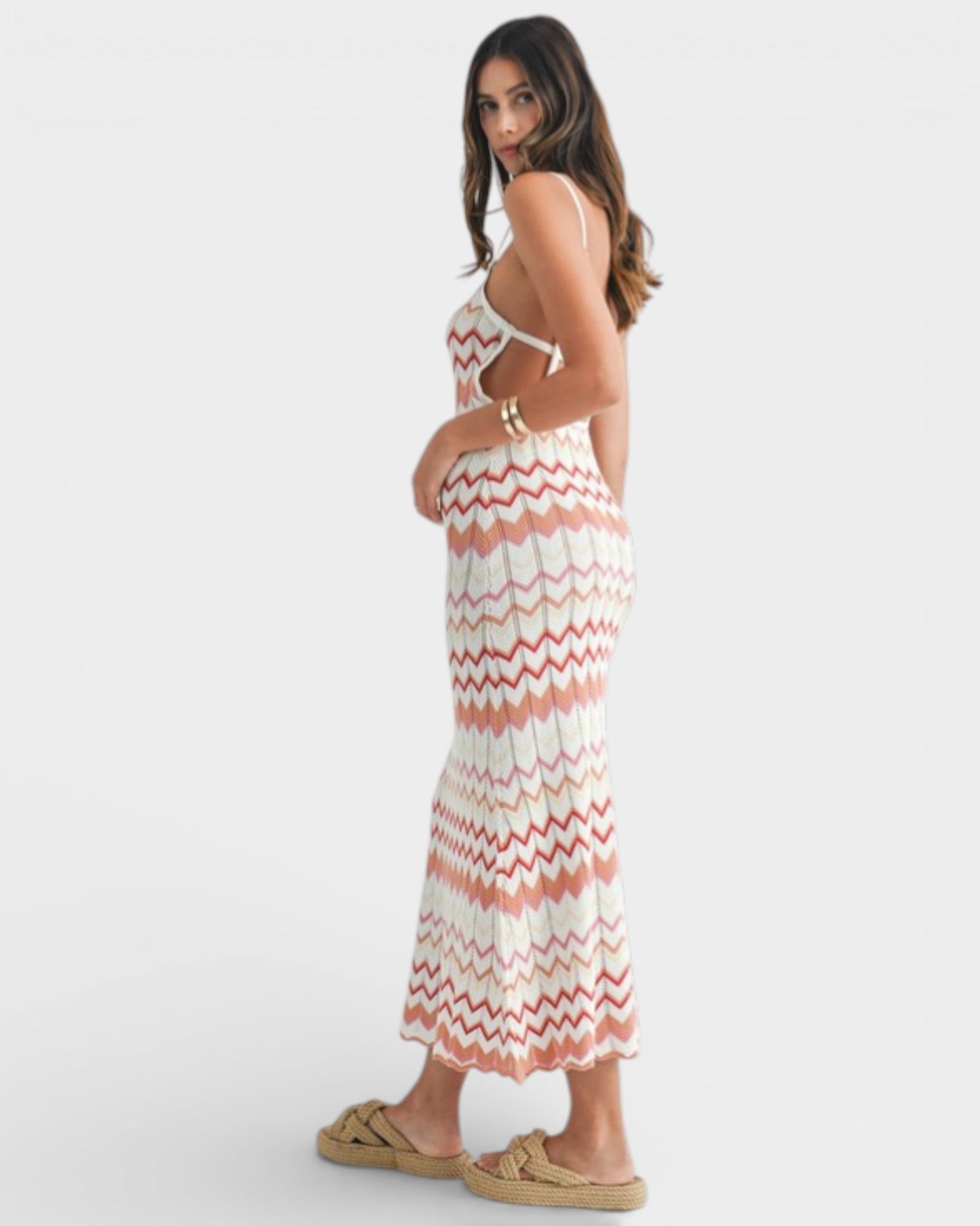 Woman wearing a striped dress on a white background