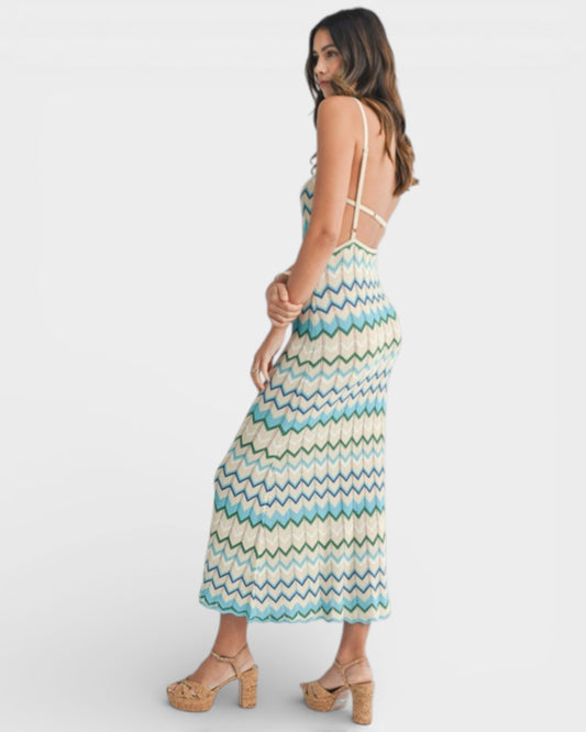 Woman wearing a patterned dress on a white background