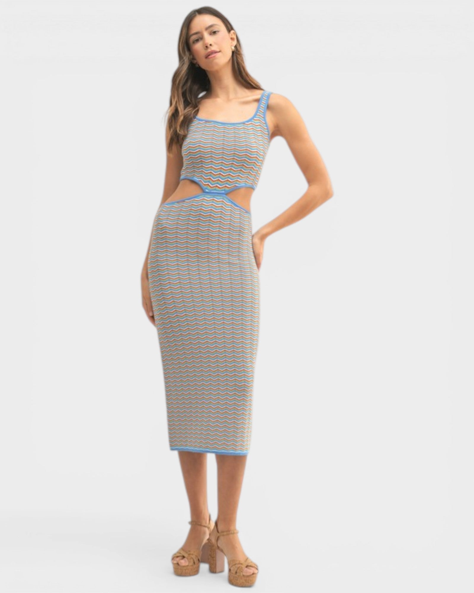 Woman wearing a patterned dress on a white background