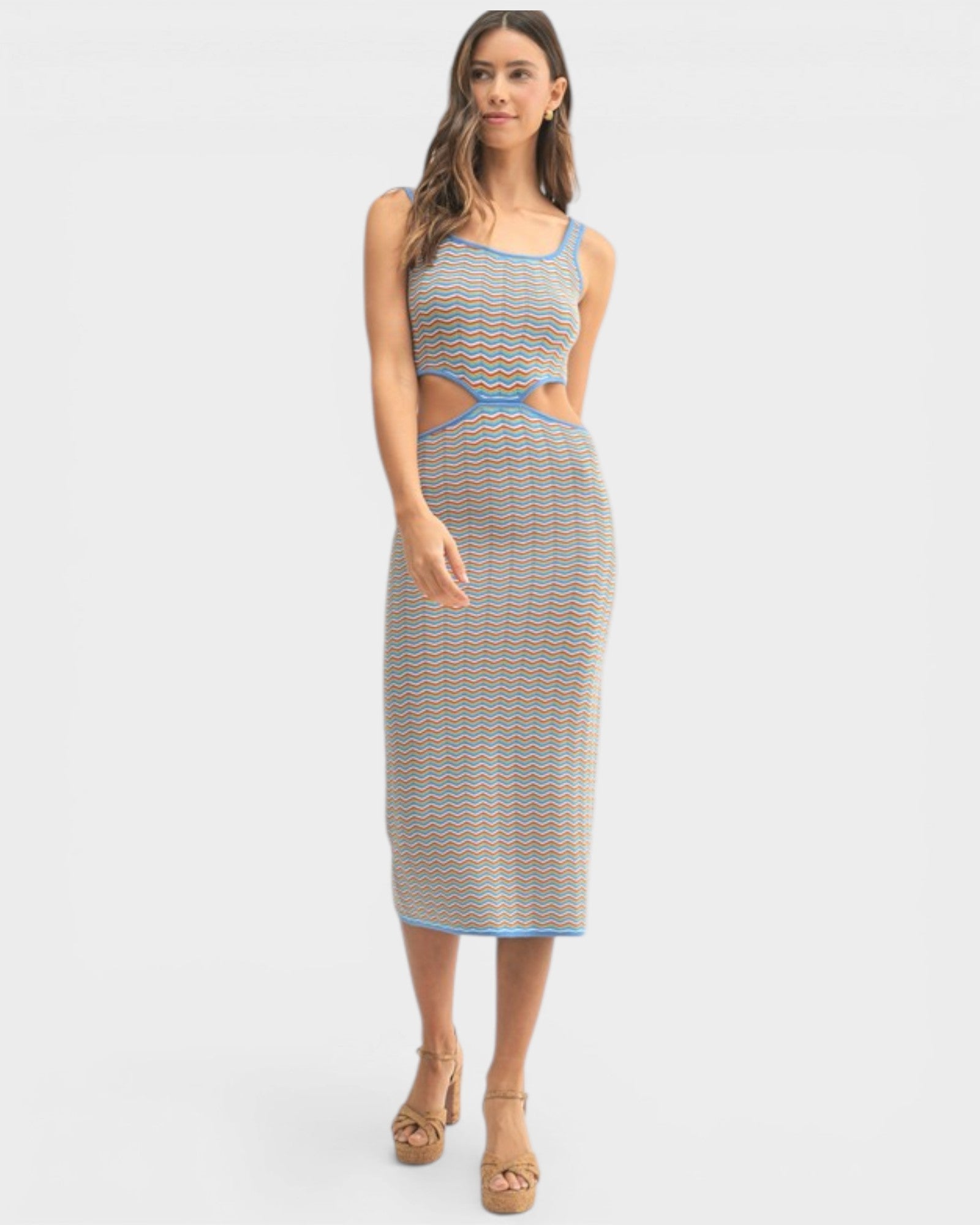 Woman wearing a patterned dress on a white background