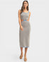 Woman wearing a patterned dress on a white background