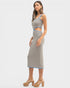 Woman wearing a patterned dress on a white background