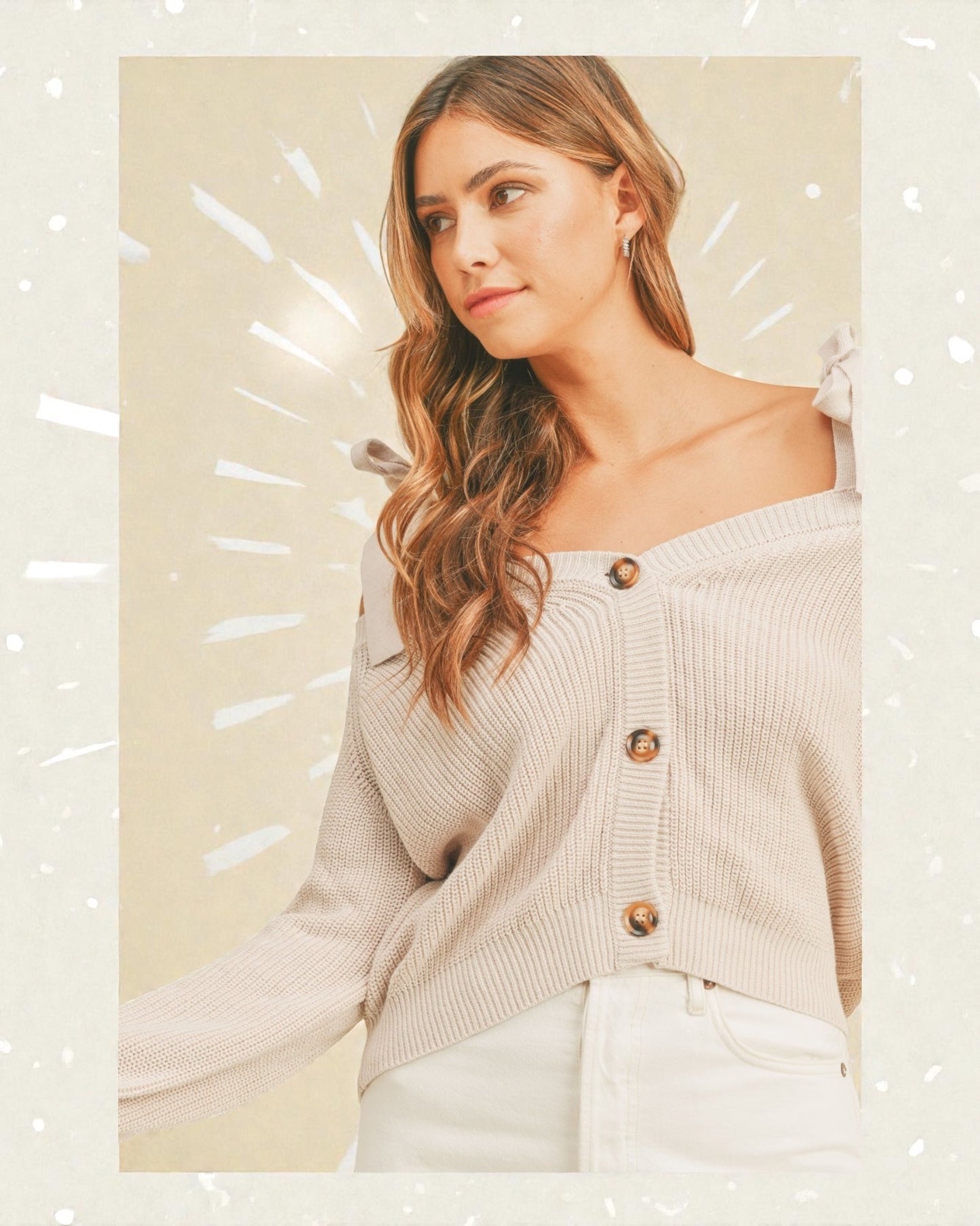 Woman wearing a beige cardigan with a neutral background