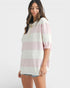 Woman wearing a striped shirt with a white background