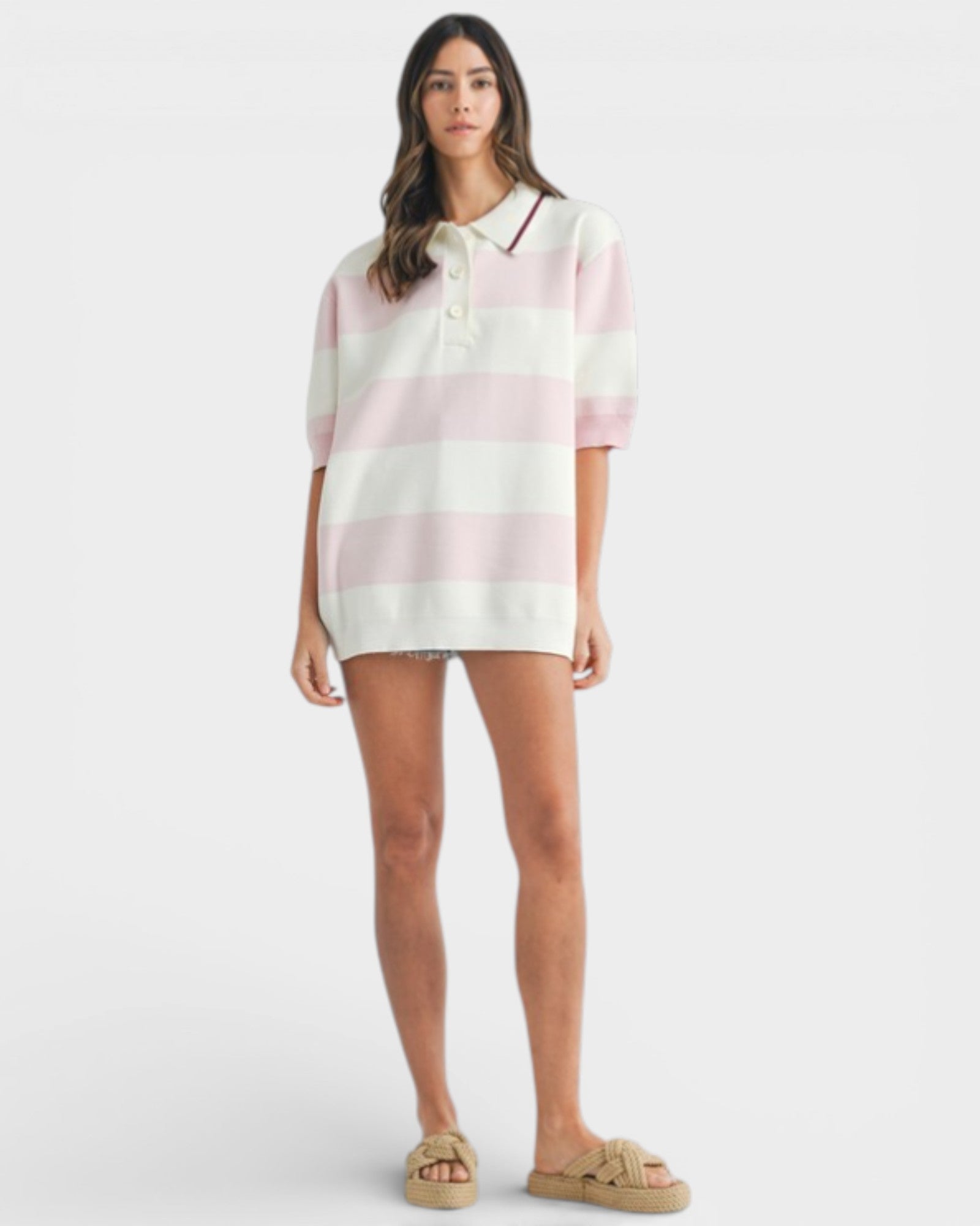Woman wearing a pink and white striped shirt on a white background