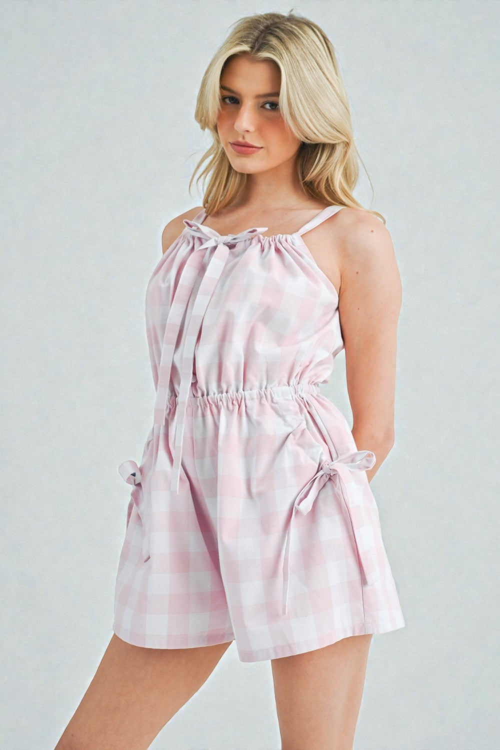 Mono sin mangas con botones a cuadros en color rosa