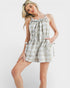 Woman wearing a plaid dress on a white background