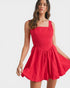 Woman wearing a red dress on a white background
