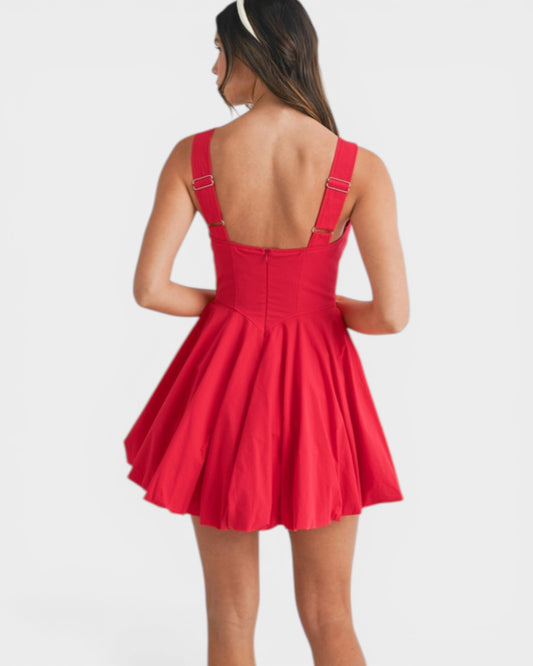 Red dress with thin straps on a white background