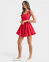 Woman wearing a red dress on a white background