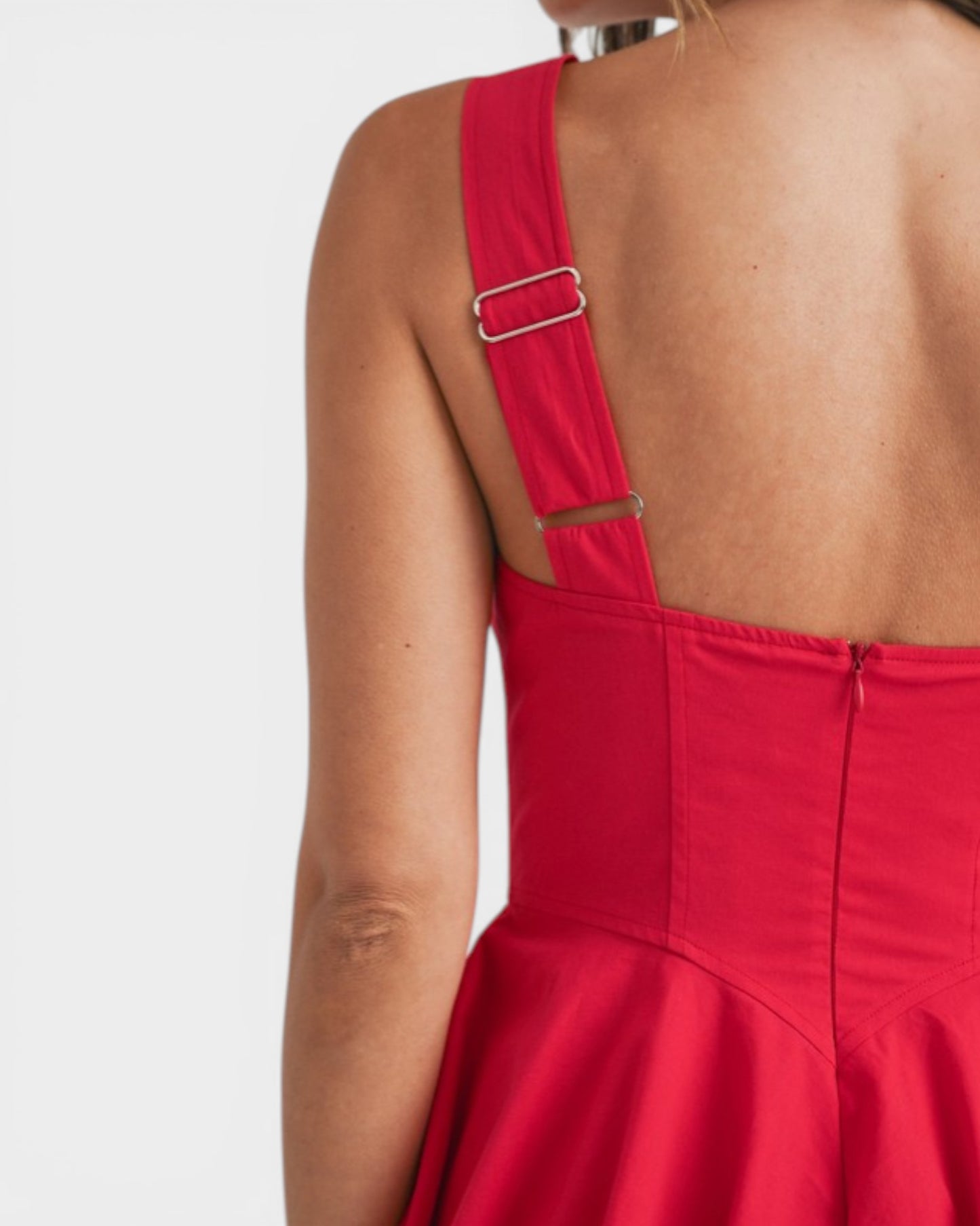 Red dress with cut-out back design on a white background