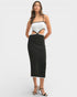 Woman wearing a white top and black skirt on a white background