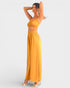 Woman wearing a yellow outfit on a white background