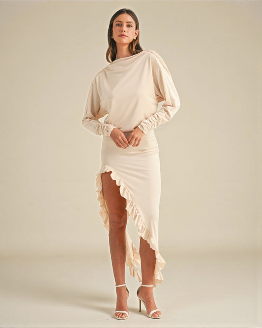 Woman wearing a beige dress with a plain background