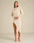 Woman wearing a beige dress with a plain background