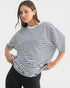 Woman wearing a black and white striped shirt on a white background