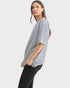 Woman wearing a black and white striped shirt on a white background