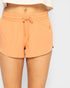 Orange shorts with a drawstring on a white background