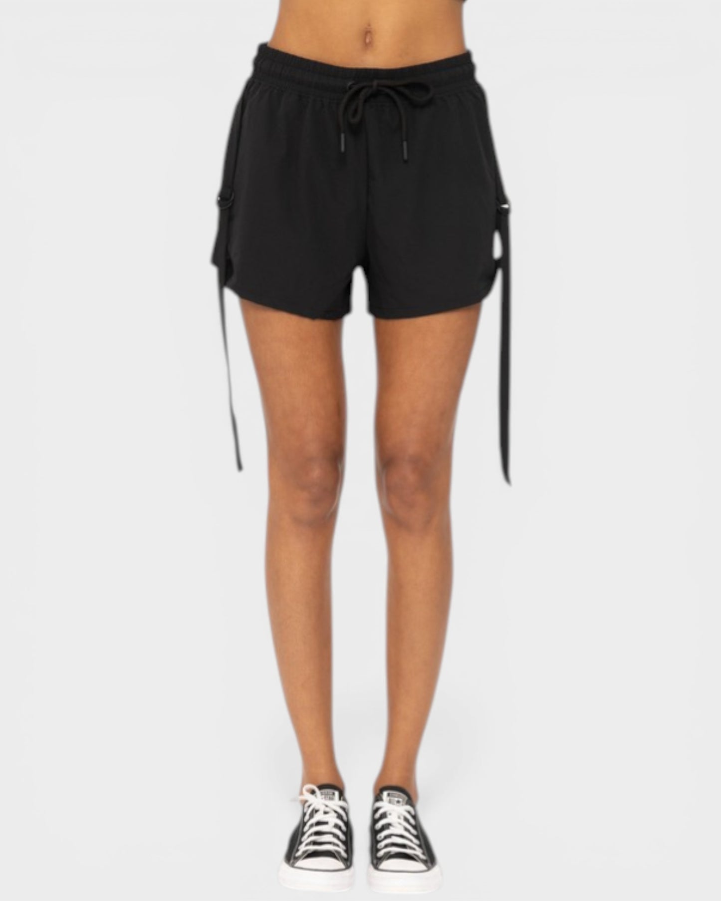 Black shorts with drawstring on a white background