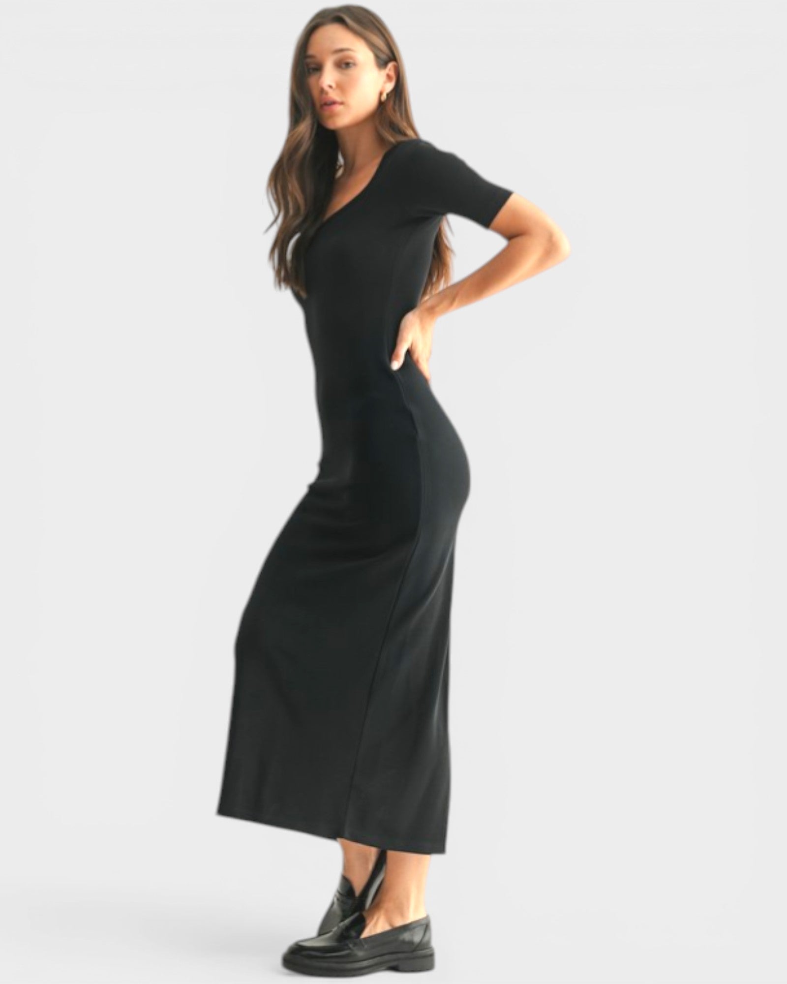 Woman wearing a black dress on a white background