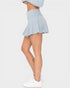 Light blue skirt worn by a person on a white background