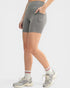 Person wearing gray athletic shorts on a white background