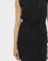 Black sleeveless dress with a tie waist on a white background