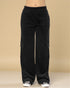 Black cargo pants on a beige background