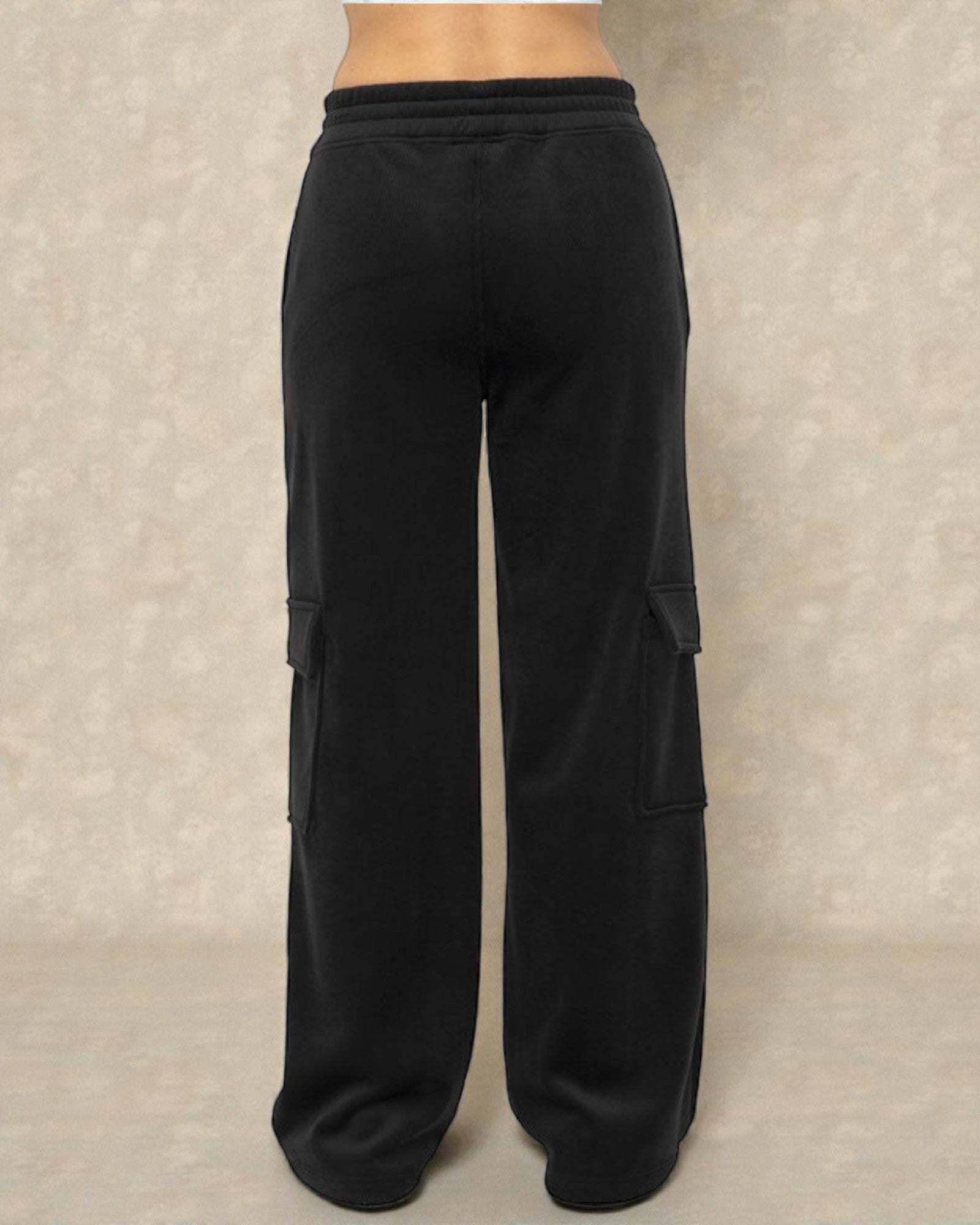 Black cargo pants on a neutral background