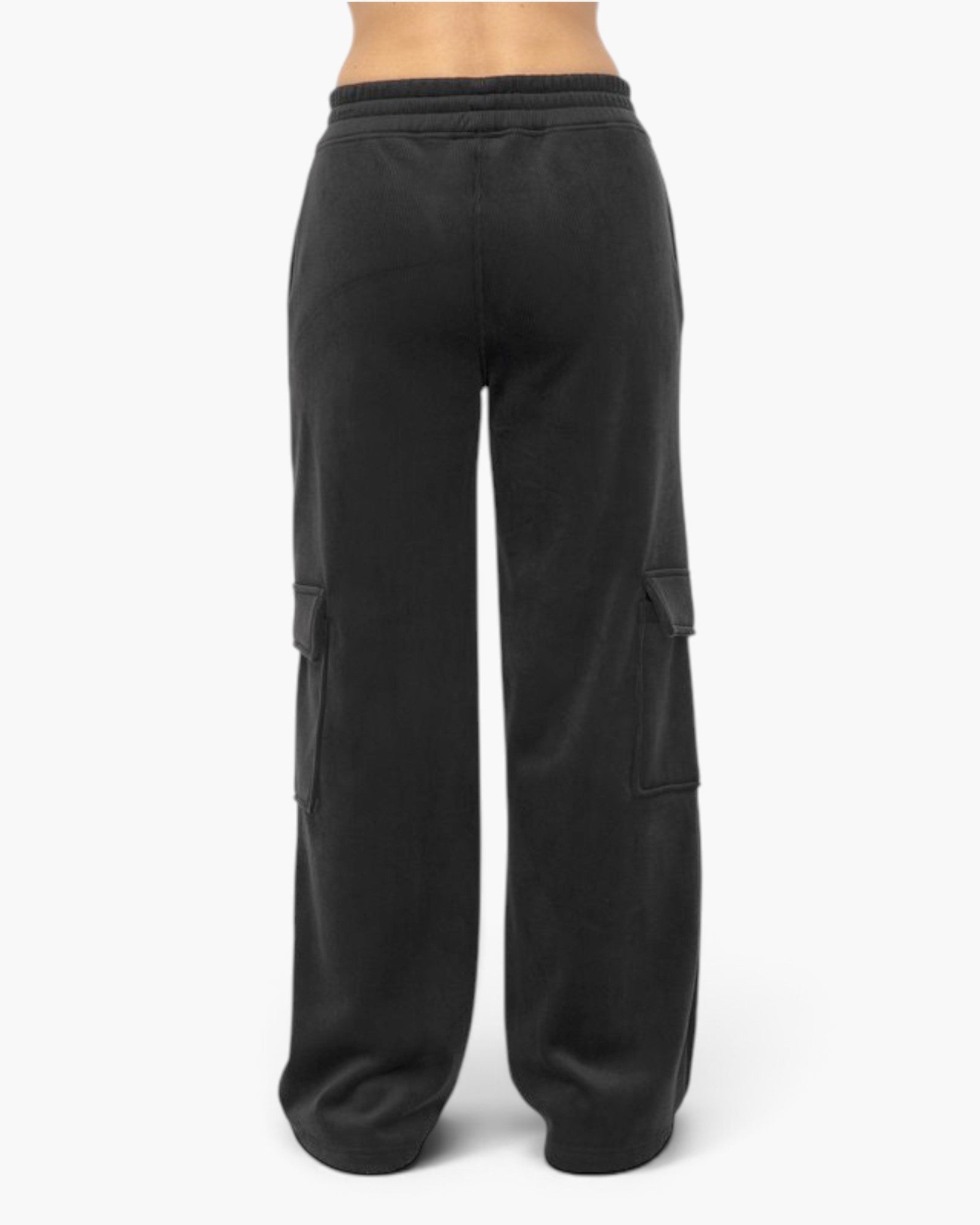 Black wide-leg cargo sweatpants shown from the back, featuring an elastic waistband and large cargo pockets on the legs, photographed against a plain white studio background.