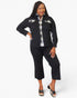 A woman modeling a black two-piece matching set consisting of a long-sleeve button-up shirt with decorative flap chest pockets and matching black cropped pants, worn over a plaid shirt.