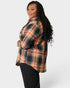 Person wearing a plaid shirt on a white background