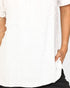 Close-up of a person wearing a white textured short-sleeve top with a hand in a side pocket, paired with black bottoms.