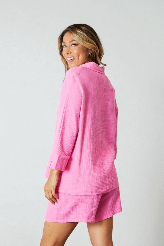 Woman wearing a pink outfit with a white background