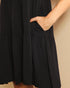 Black dress with a plain background