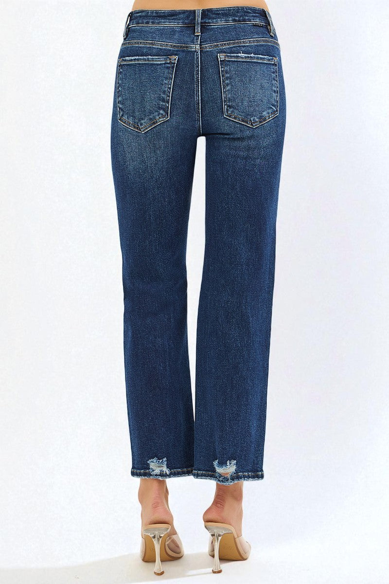 Blue jeans worn by a person on a white background