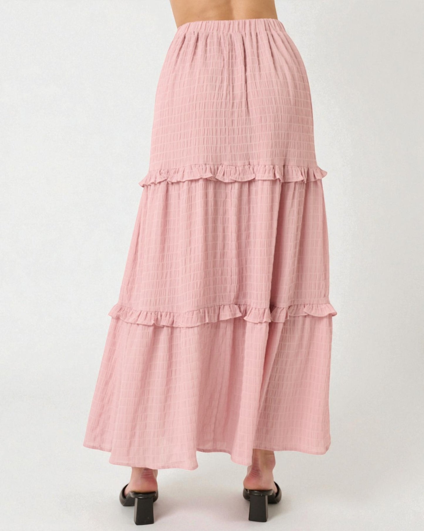 Pink tiered skirt on a white background