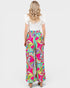 Woman wearing colorful patterned pants on a white background