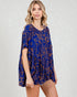 Woman wearing a blue patterned dress on a white background