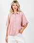 Woman wearing a pink blouse with a white background