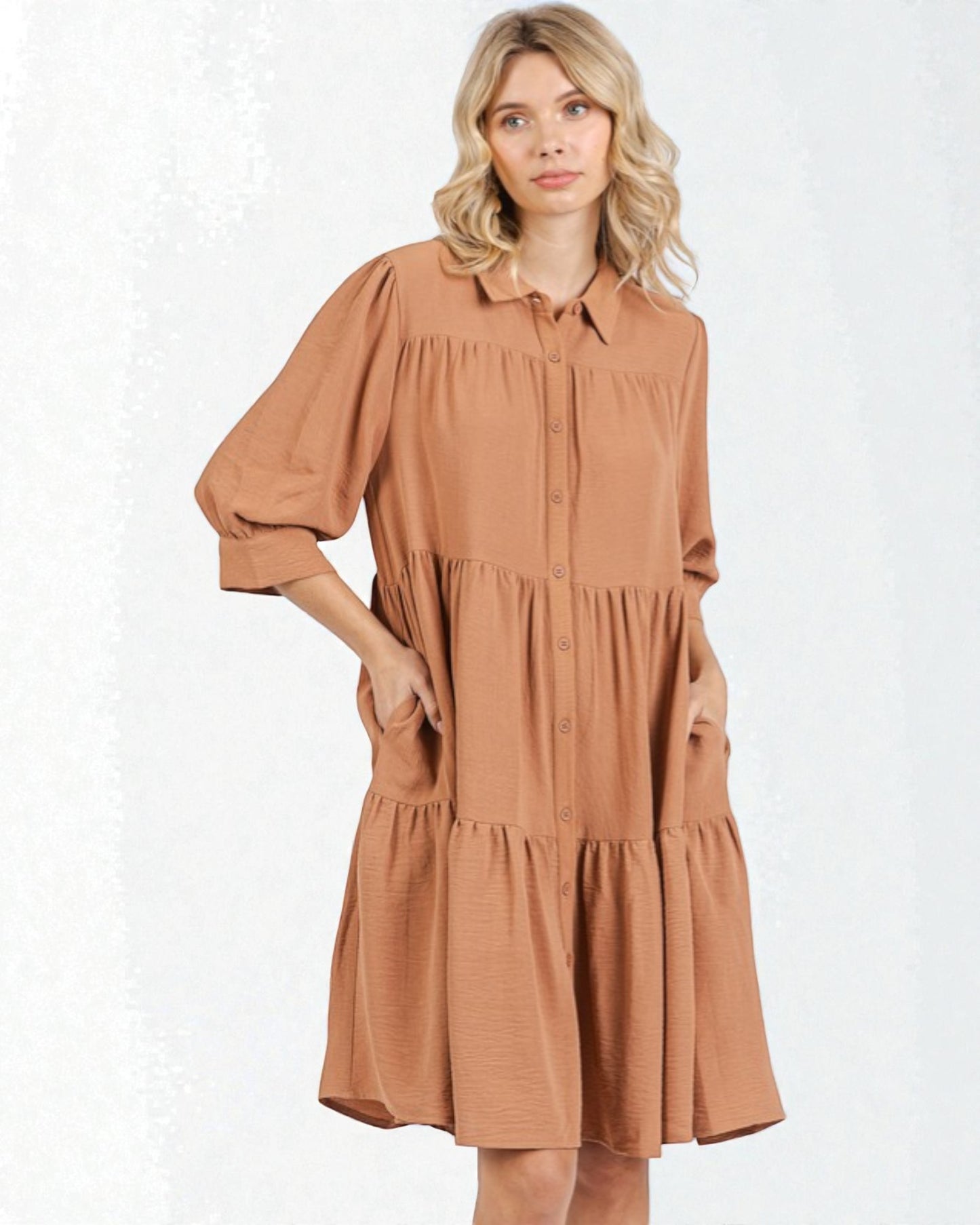 Woman wearing a brown dress on a white background