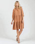 Woman wearing a brown dress on a white background