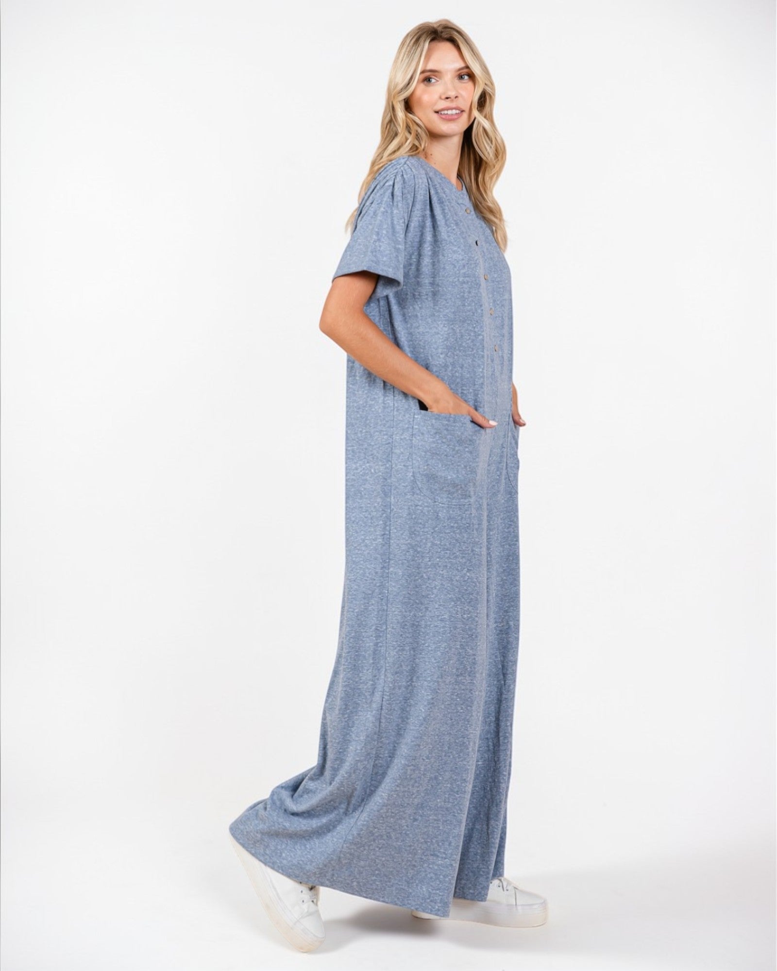 Woman wearing a blue dress on a white background