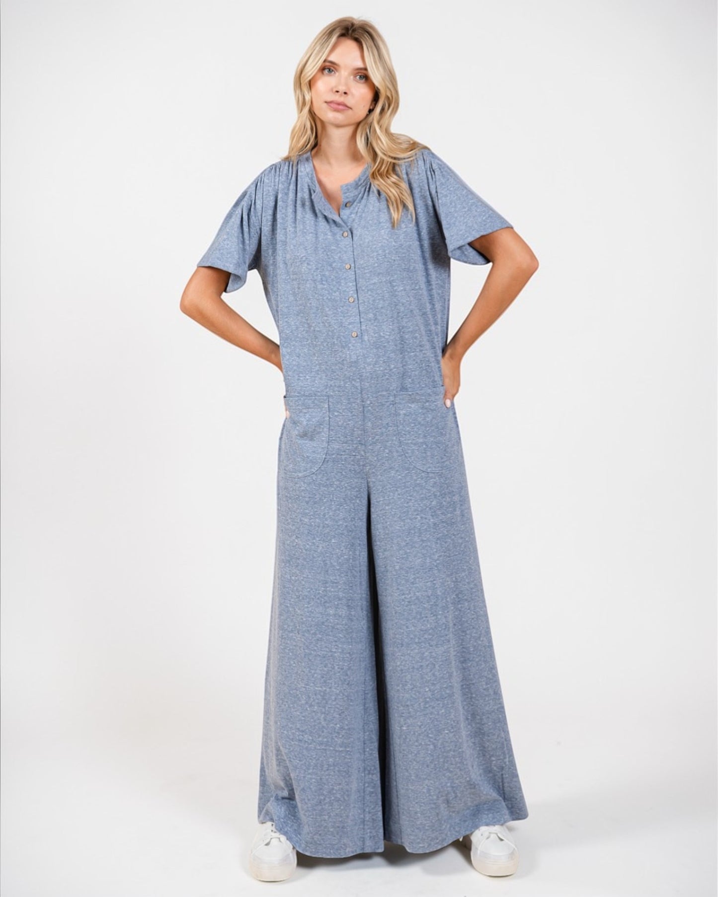 Woman wearing a blue dress on a white background