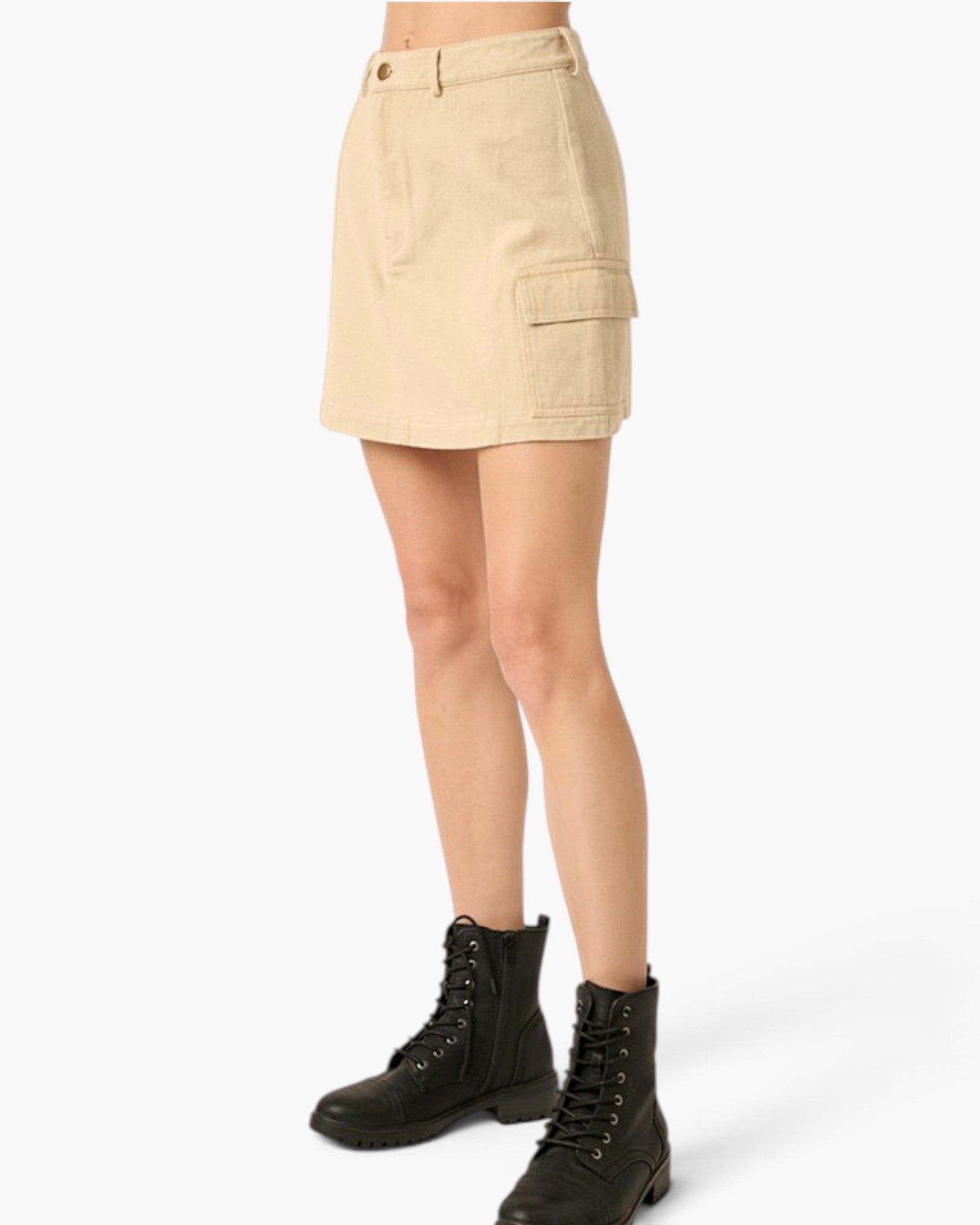 A model wearing a beige cargo mini skirt and black lace-up combat boots, shown from the waist down against a light gray studio background.